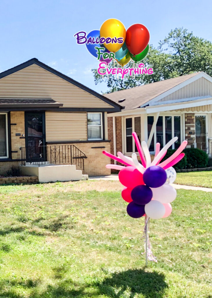 Colorful balloons outside the house